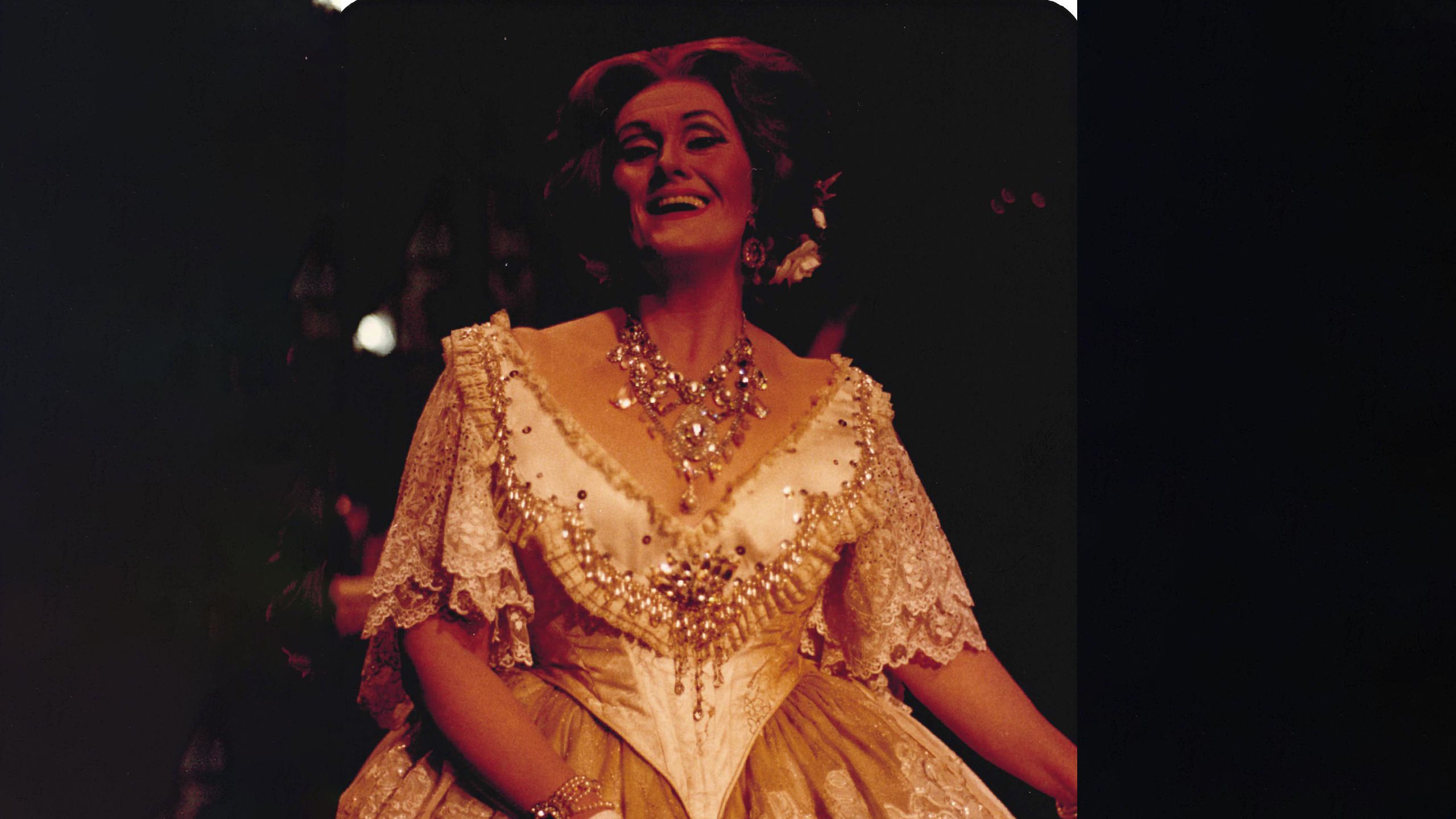 An informal photograph of Joan Sutherland smiling while wearing the dress seen in the previous image