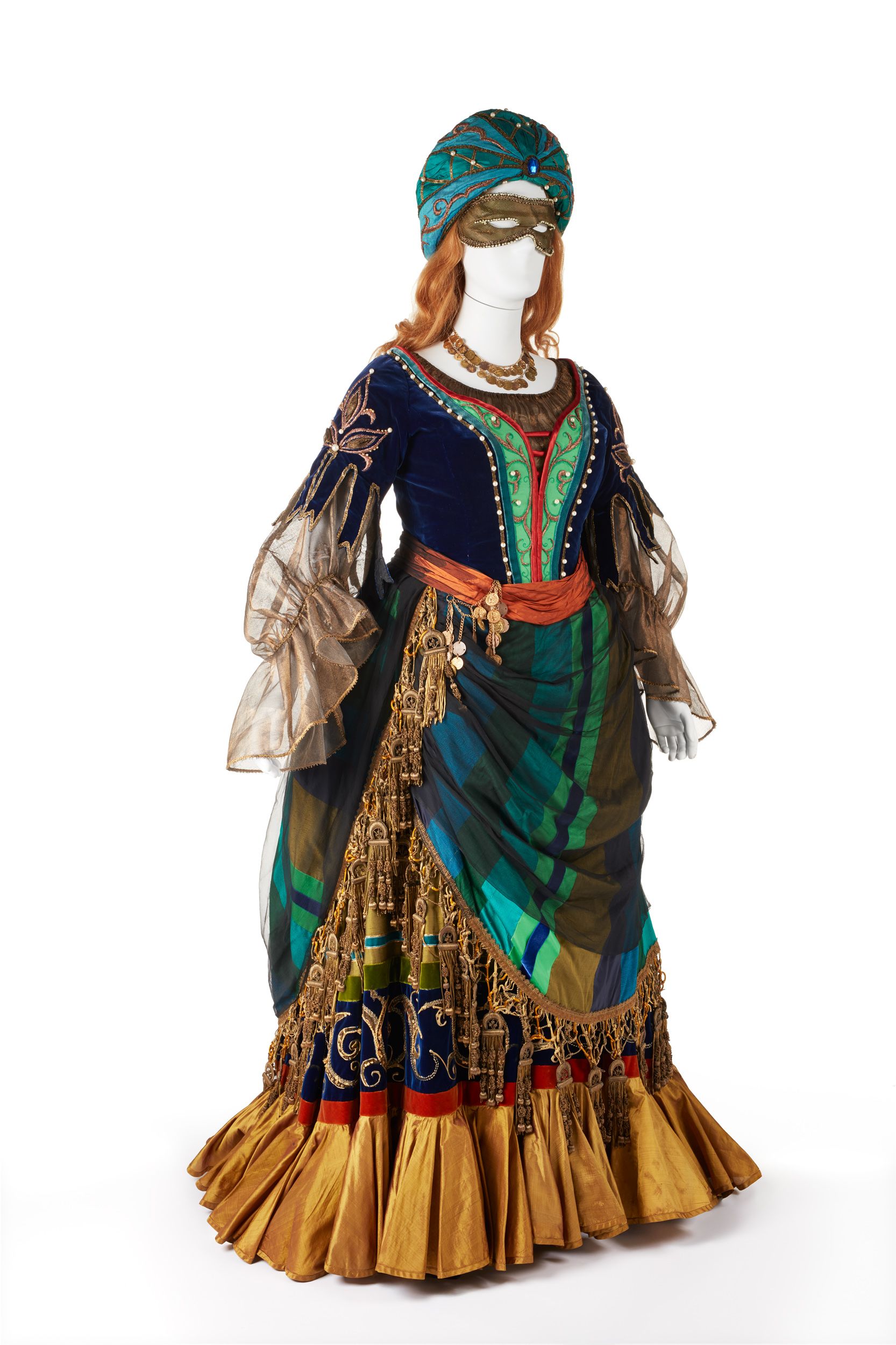 A view of the top part of the Lucrezia Borgia costume, which includes a blue and gold turban and gold coloured eye mask.