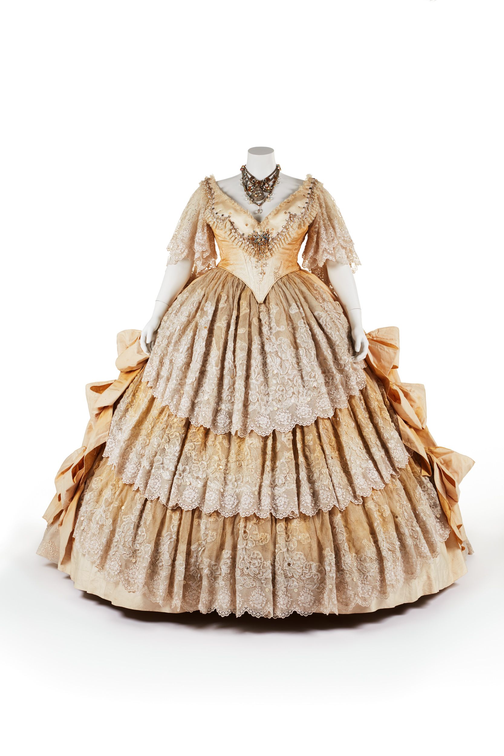 A white coloured dress with elaborate skirts