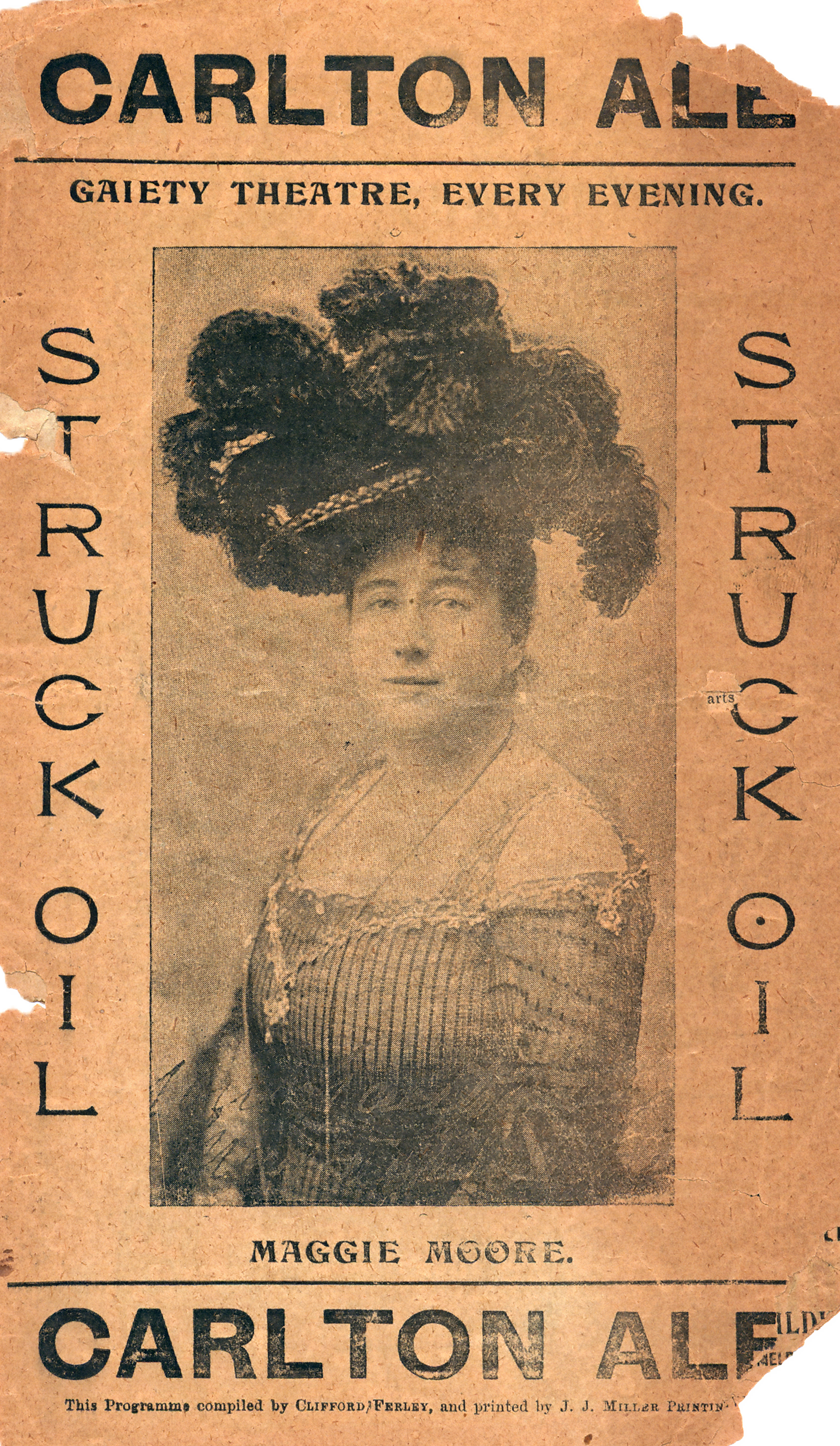 Front cover of early twentieth century programme featuring a portrait of a woman in the centre. She is wearing a large feathered headdress with an off-the shoulder costume. She is looking at the camera. 