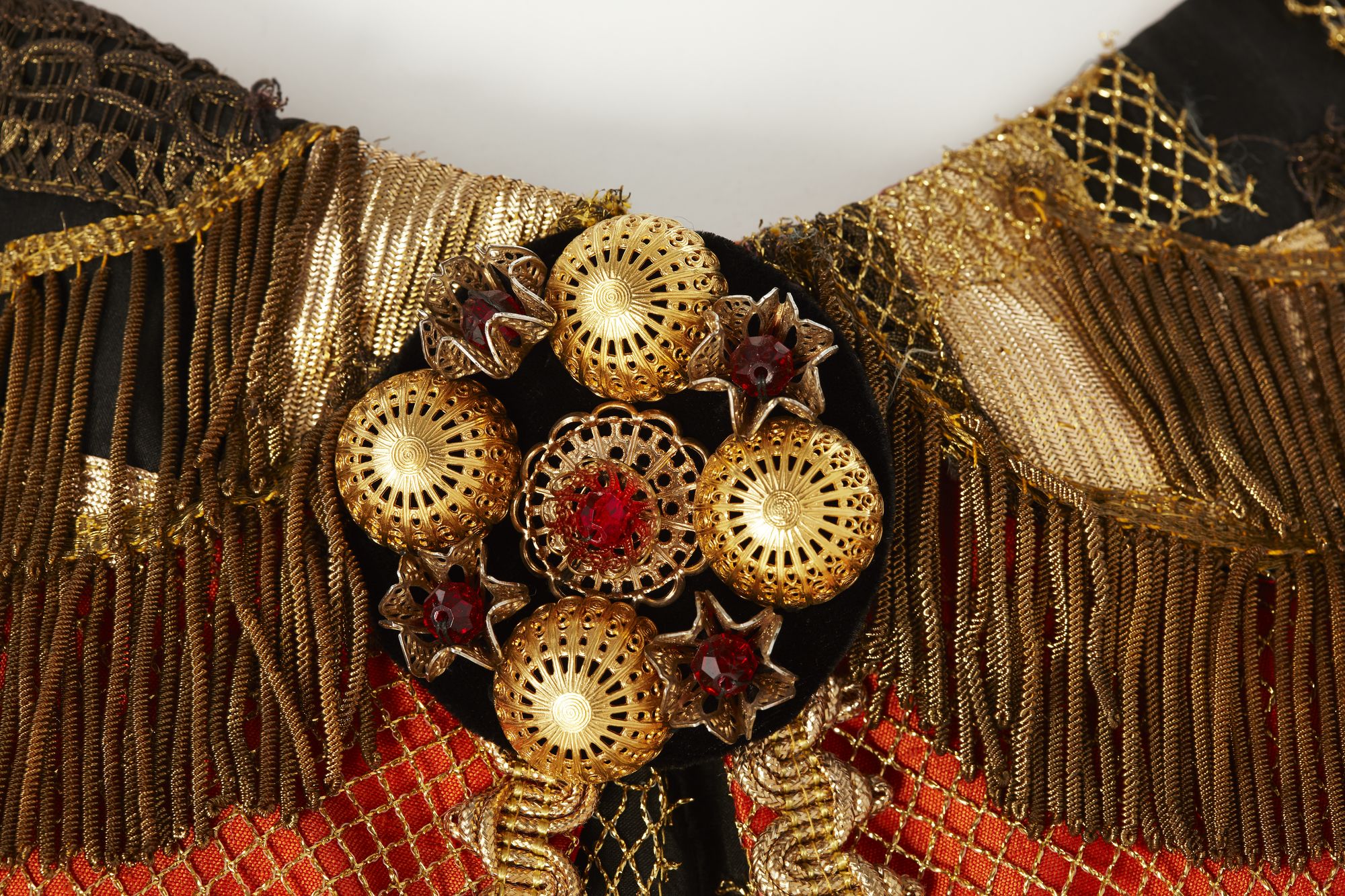 Close up view of gold jeweled clasp of costume worn by Joan Sutherland for the title role of Semiramide.