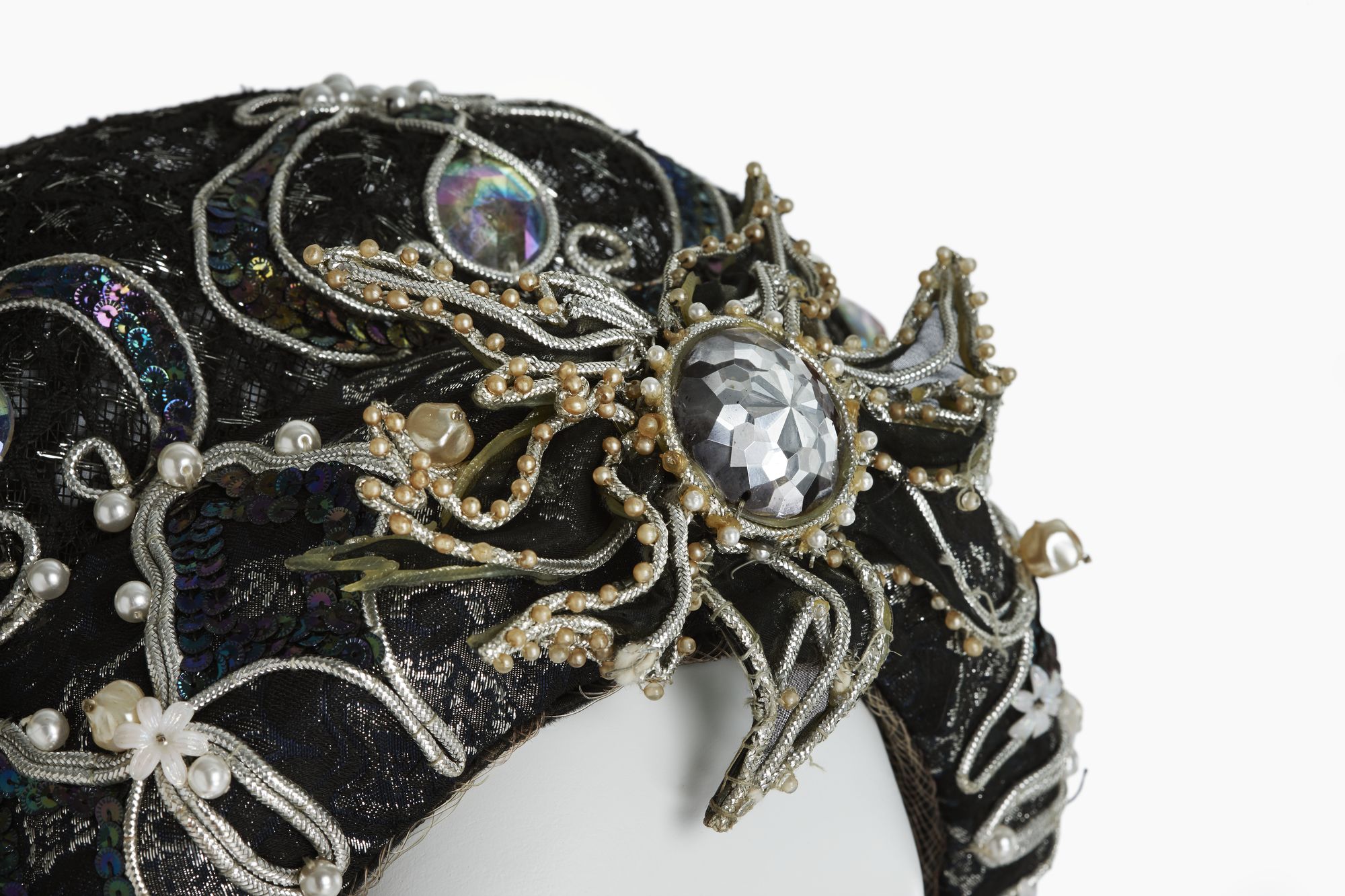 Detail of head dress showing beading and embellishment on costume worn by Joan Sutherland in Lucrezia Bogia.