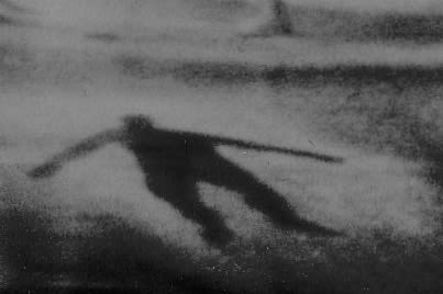 Close up of single silhouetted outlines of a body on a stage floor.