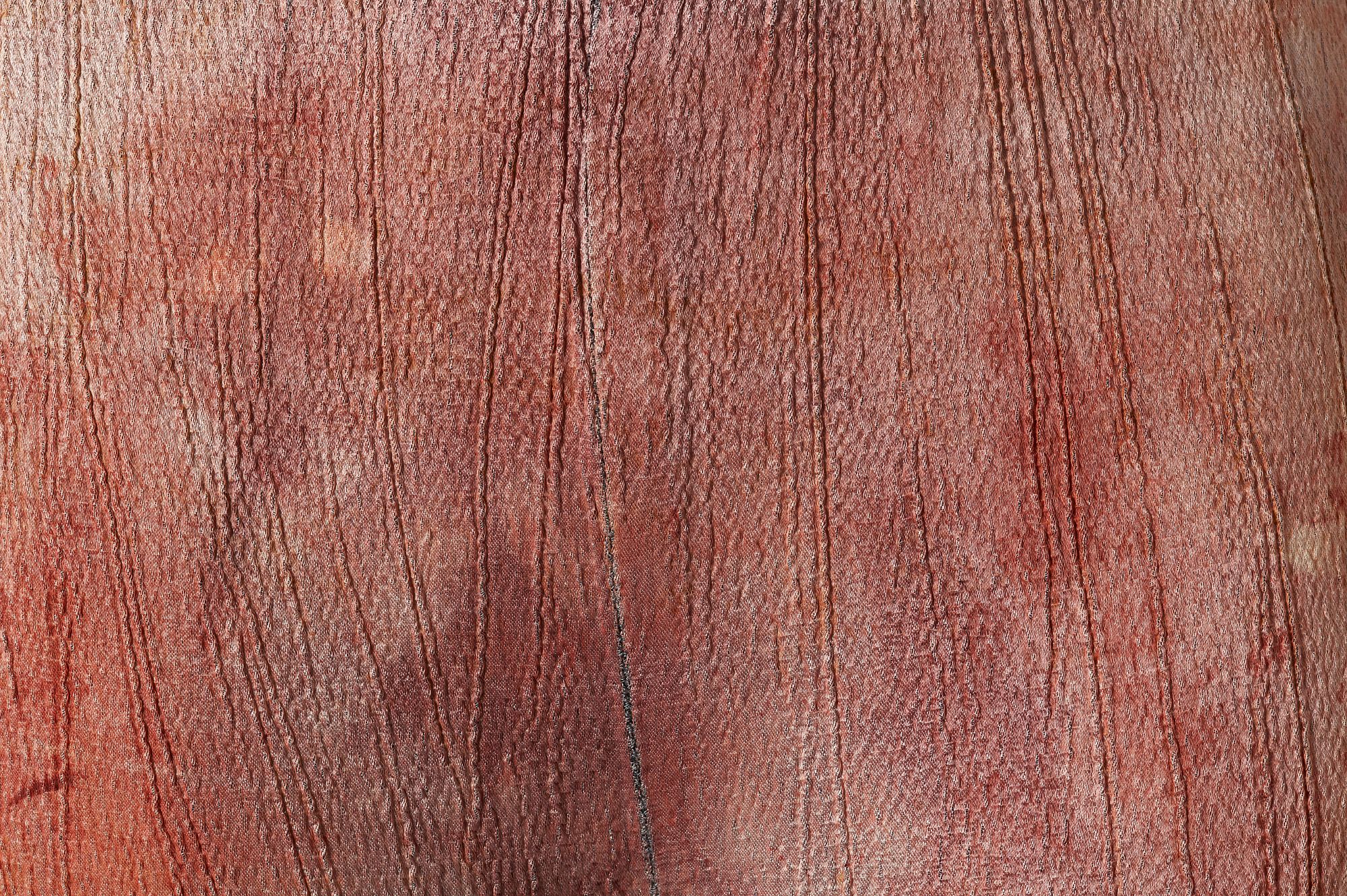 Close of up textured, mottled brown and red fabric