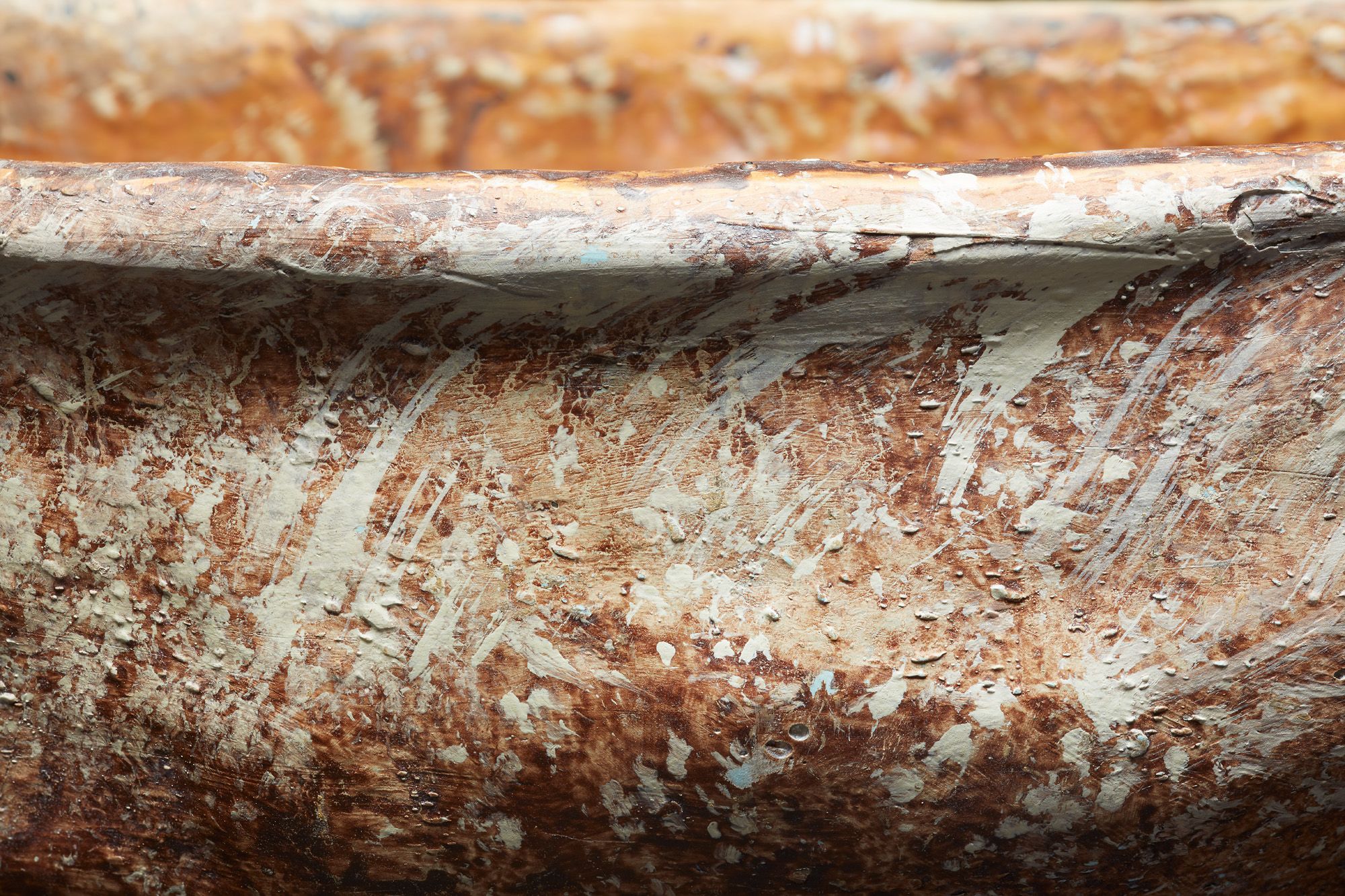 Close up of an ochre covered dish.