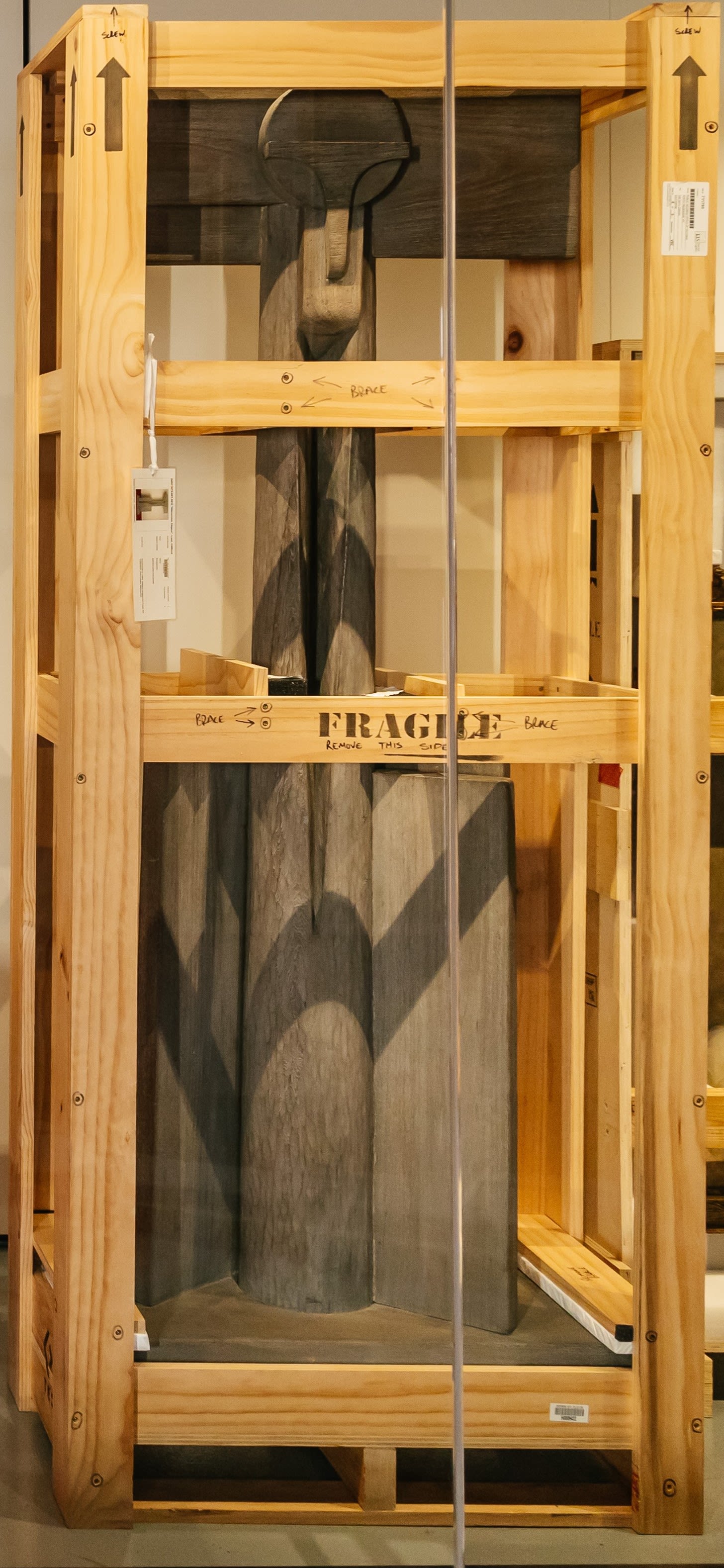 Photograph of a sculpture in a crate.