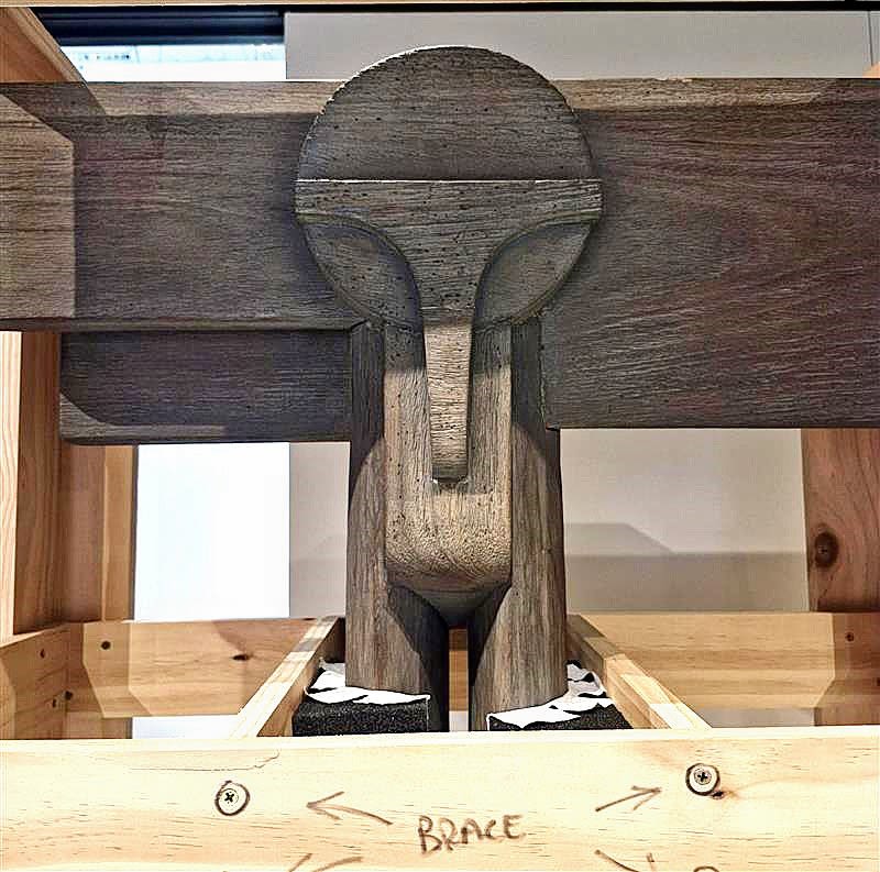 Close up photograph of a sculpture in a crate.