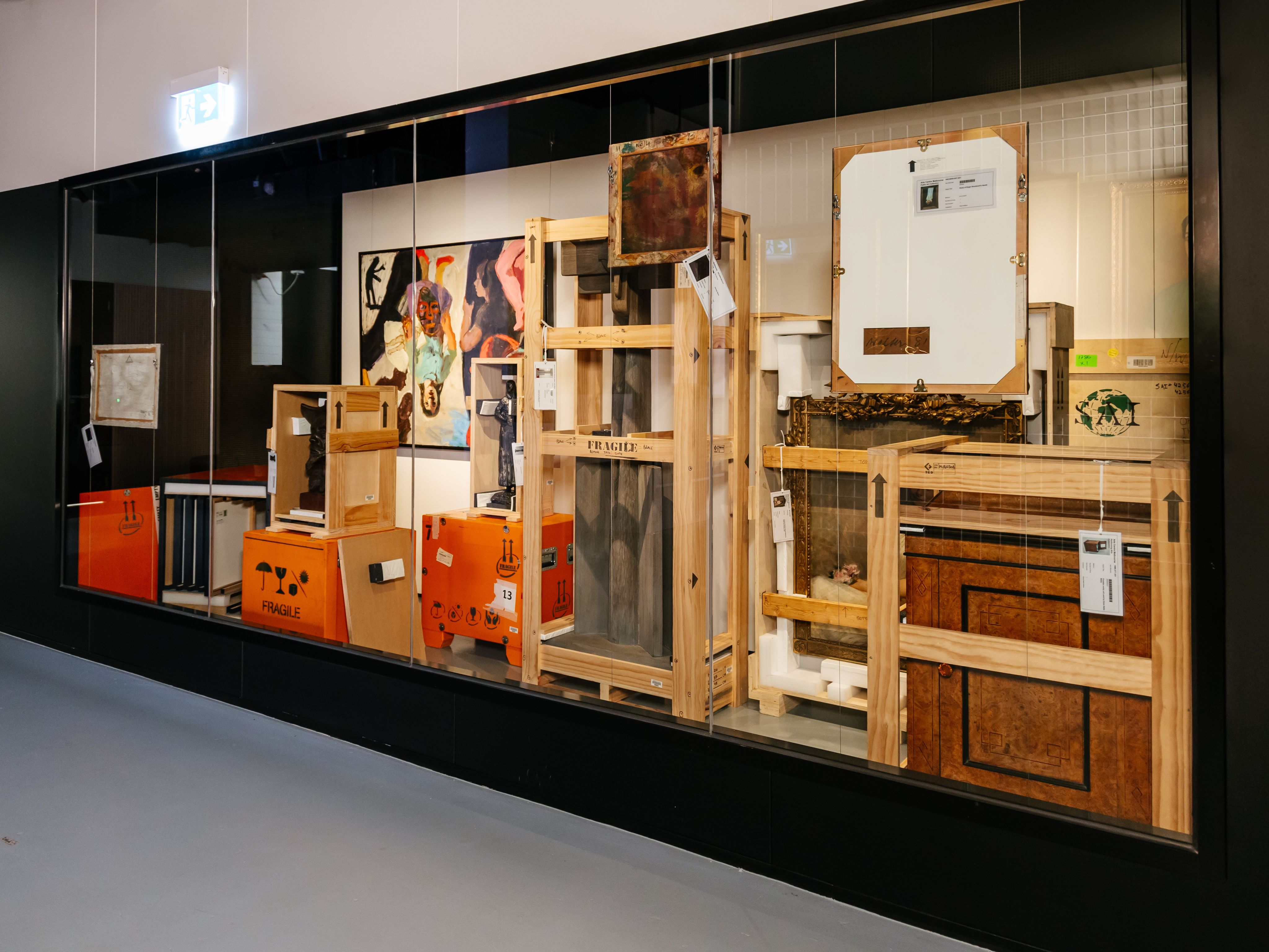Photograph of artworks and sculptures in various states of crating and packing.