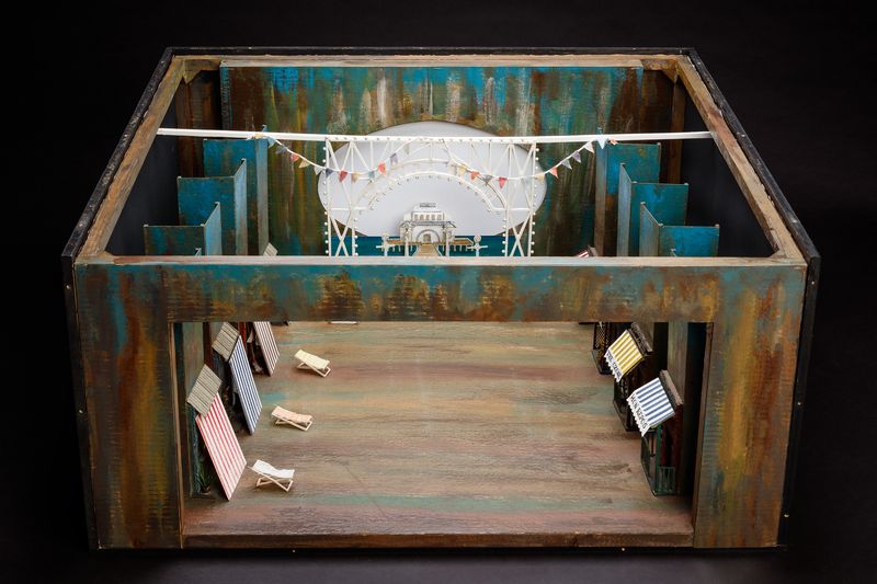 A painted set model showing St Kilda Pier and beach