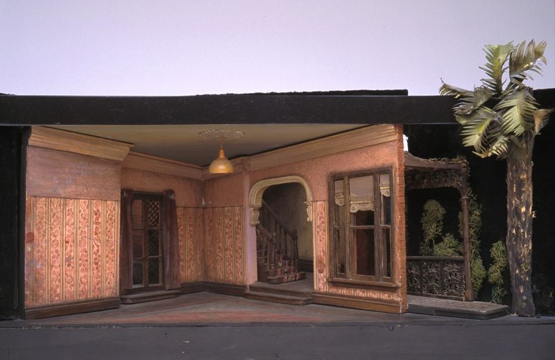 A small set model showing the 1950s interior of a terraced house.
